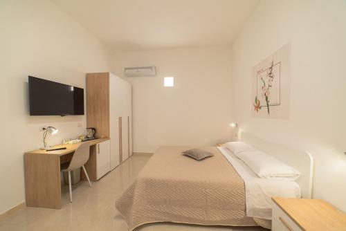 Quadruple Room with Balcony room in B&B MANDORLO BIANCO