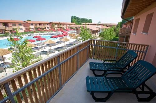 Green Village Resort Green Village Resort Hotel & Aparthotel is conveniently located in the popular Lignano Riviera area. The hotel offers a wide range of amenities and perks to ensure you have a great time. To be found a