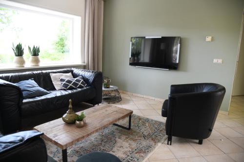 Спільний лаунж/ТБ зона, Boshuis Golfzicht "Wellness, Golf & Nature" in Остерхут