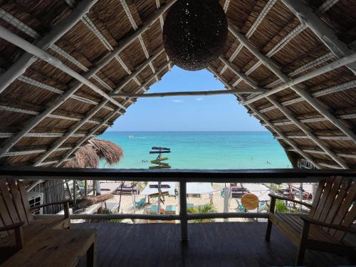 Caribbean sea view from under a triangular shaped roof at a Playa Blanca hotel in Barú.