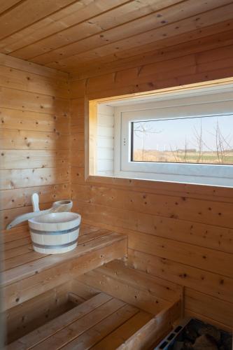 桑拿, Ferienhaus Hemenswarft direkt an der Nordsee mit Meerblick in 埃梅爾斯布爾-霍爾斯布爾