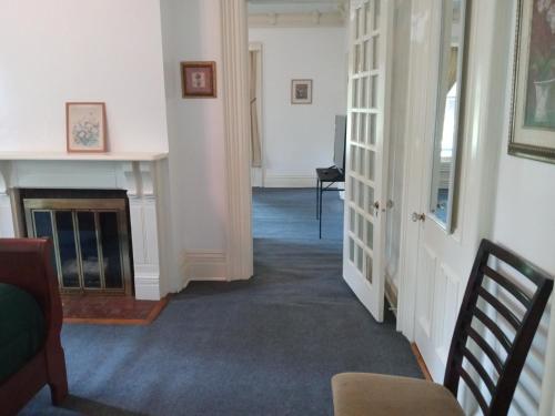 Mini Mansion Hotel near public transportation is the yellow and green house on the corner of 8th st and Madison avenue