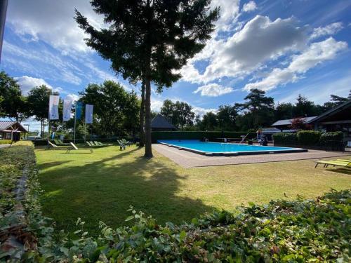 Knus huisje op kindvriendelijk park met zwembad in Otterlo