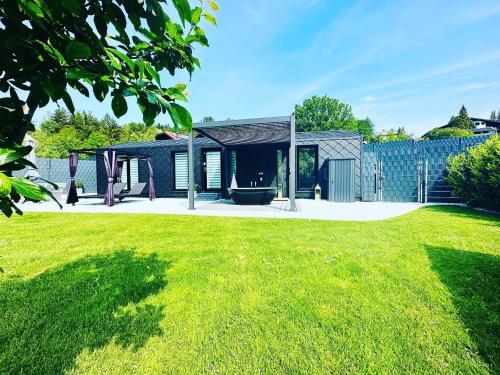 Voralpen Lodge - Ferienhaus mit Gym & Wellnessbereich in Traisen