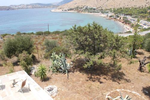 Strand, Aegean traditional home in Athens Riviera in Thimári