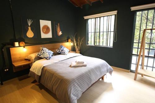 Apartamento cerca Unidad Deportiva Belén - ONE202 By Roots Rentals