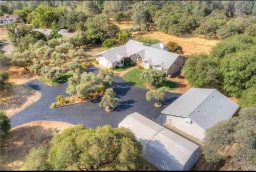 Spacious home with pool, bar, game room, parking, on 5 private acres.