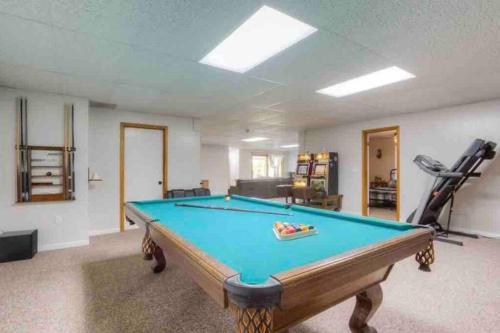 Spacious home with pool, bar, game room, parking, on 5 private acres.