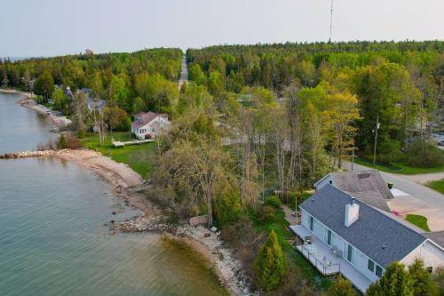 Lakefront De Tour Village Home w/ Deck & Fire Pit!