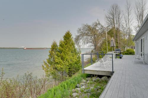 Lakefront De Tour Village Home with Deck and Fire Pit!