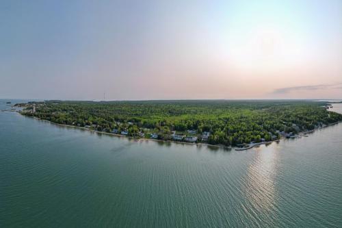 Lakefront De Tour Village Home with Deck and Fire Pit!