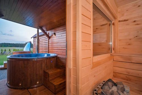 ZACISZE W OGRÓDKU Dom z balią i sauną (ZACISZE W OGRODKU Dom z balia i sauna) in Ogródek