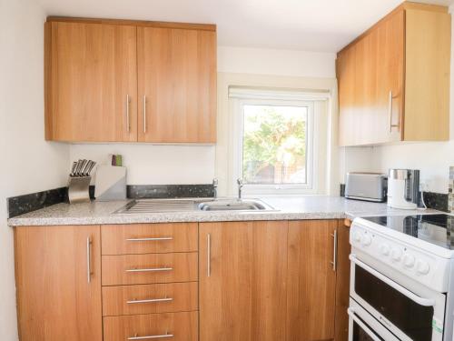 Зовнішній вигляд готелю, Pow-Wow Shore Cottage in Powfoot