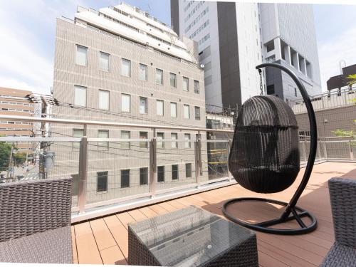 Shared lounge/TV area, Tabist MAYUDAMA CABIN in Yokohamabashi