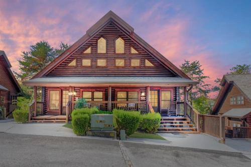 2 Miles from Dollywood Family Resort with Seasonal Outdoor Swimming Pool, Year around Heated Indoor Swimming Pool, Townhome Style Cabin, Private Hot Tub, Arcade, TV, Wifi, Kitchen with Refrigerator, Washer and Dryer in Pigeon Forge, USA