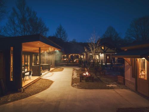 Premium villa glamping log cabin with stars and bonfire