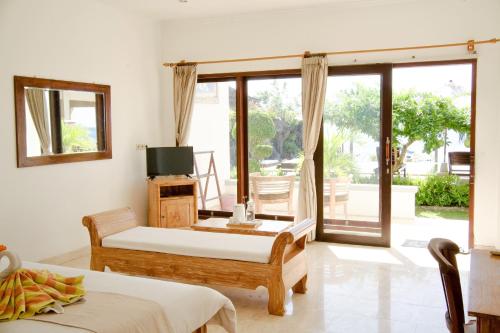 Alam Bali Beach Resort - Tap to explore photos