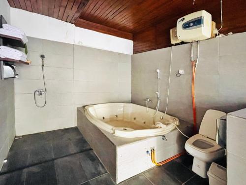 Bathroom, Lazuardy Syariah Park and Villa in Cisarua