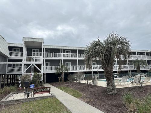 OCEAN VIEW condo with POOL steps from the beach! Your Driftwood Oasis awaits!