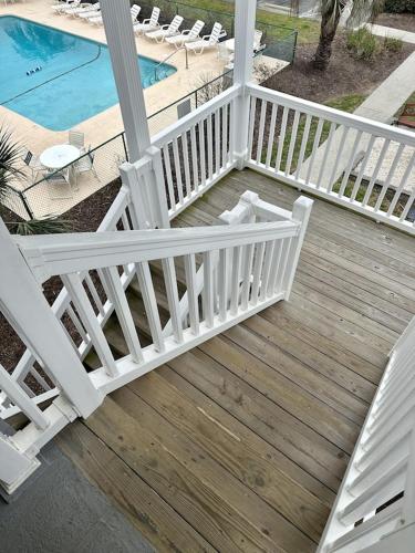 OCEAN VIEW condo with POOL steps from the beach! Your Driftwood Oasis awaits!