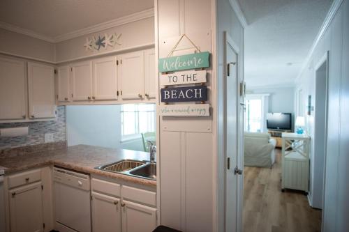 OCEAN VIEW condo with POOL steps from the beach! Your Driftwood Oasis awaits!