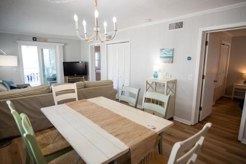 OCEAN VIEW condo with POOL steps from the beach! Your Driftwood Oasis awaits!