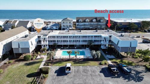 OCEAN VIEW condo with POOL steps from the beach! Your Driftwood Oasis awaits!