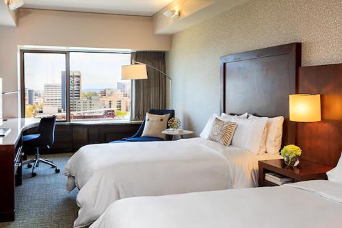 Guest Room with Two Double Beds and City View