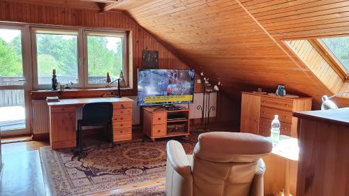 Koplietošanas atpūtas telpa ar TV, Całoroczny duży dom na Mazurach n.Jeziorem Omulew. (Caloroczny duzy dom na Mazurach n.Jeziorem Omulew.) in Lipowo Kurkowskie