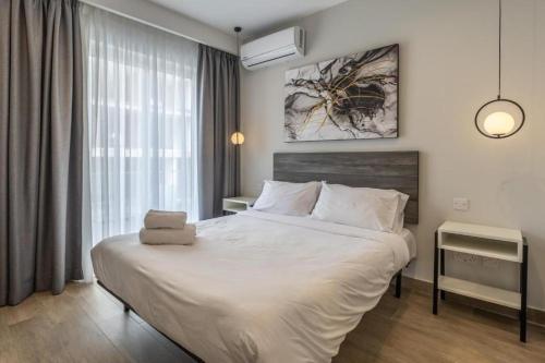 Studio 33 with twin beds & kitchenette at the new Olo living - Chambre d'hôtes - Paceville