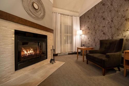 Comfort room with 1 Queen bed and sofa bed with fireplace