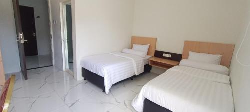 Hotel Apex Dobo Room Type - Standard Twin Room
