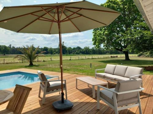 Dārzs, Maison neuve avec piscine chauffée, 4 kms de Contis plage (Maison neuve avec piscine chauffee, 4 kms de Contis plage) in St Julien En Born