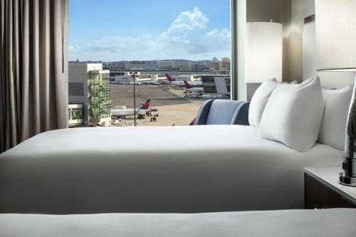 Queen Room with Two Queen Beds and Airport View- Non-Smoking
