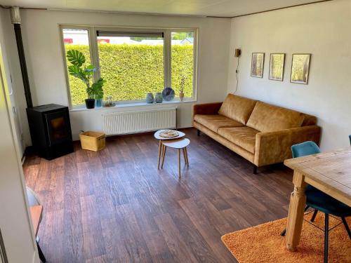 Attractive chalet with enclosed garden near sea in Tzummarum