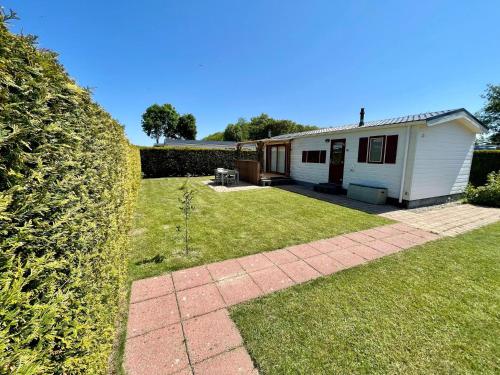 Attractive chalet with enclosed garden near sea in 8851 RB Tzummarum
