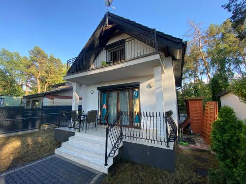Luksusowy domek letniskowy z widokiem na jezioro, 8 osób Kamionki Małe (Luksusowy domek letniskowy z widokiem na jezioro, 8 osob Kamionki Male) in Turzno
