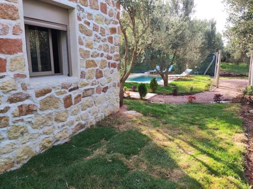 정원, Magnifique maison en pierre in Settat