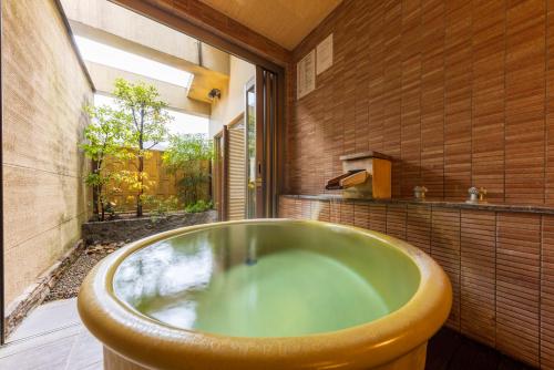 Family Room with Tatami Area and Private Open-Air Bath with Mountain View