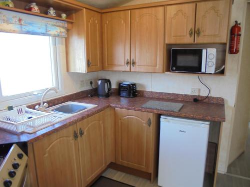 Kitchen, Waterside: Waterside Salisbury:- 6 Berth Large Wrap Around Veranda in Ingoldmells