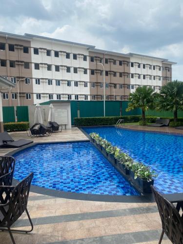 Swimmingpool, Apartment (28 m²), 1 Schlafzimmer und 1 eigene Badezimmer in Marilao (Twenty-Nine Cats @ SMDC Cheer Residences Marilao) in Valenzuela