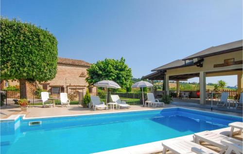 Foto 1: Amazing Apartment In Monte Rinaldo With Outdoor Swimming Pool, Wifi And 3 Bedrooms