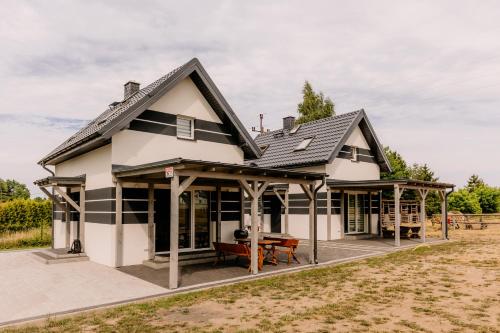 Domki Sasino - nowe, komfortowe, całoroczne domki nad morzem "Ranczo Sasino"