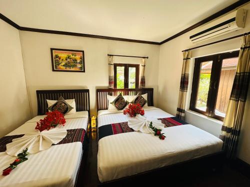 Deluxe Triple Room room in Thatsaphone Hotel