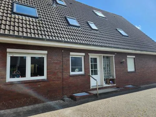 Gästezimmer mit Wohnzimmer in Norddeich in Norden, Deutschland