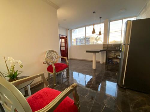 Suites AlojaT MIMOS Machala diagonal al oro verde.