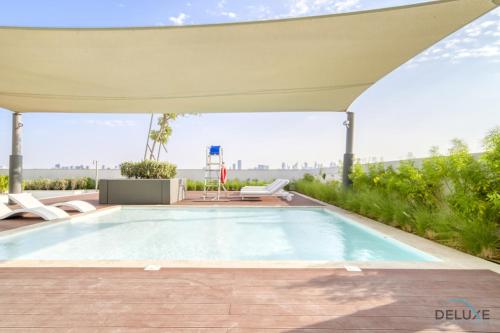 Swimming pool, Peaceful 1BR at The Anwa By Omniyat Dubai Maritime City by Deluxe Holiday Homes in Dubai Maritime City