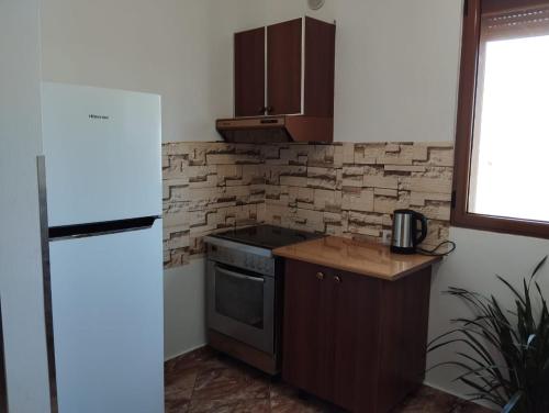 Cozinha, The Garden Guest House in Divjake