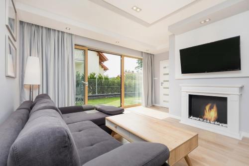 Koplietošanas atpūtas telpa ar TV, Lux Holiday House Posejdon with Parking by Renters Prestige in Kolczewo