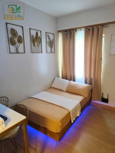 Trees Residences Staycation Evol's Place - Tap to explore photos